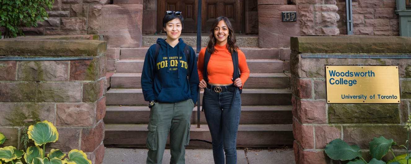 Two Woodsworth students standing in front of the College