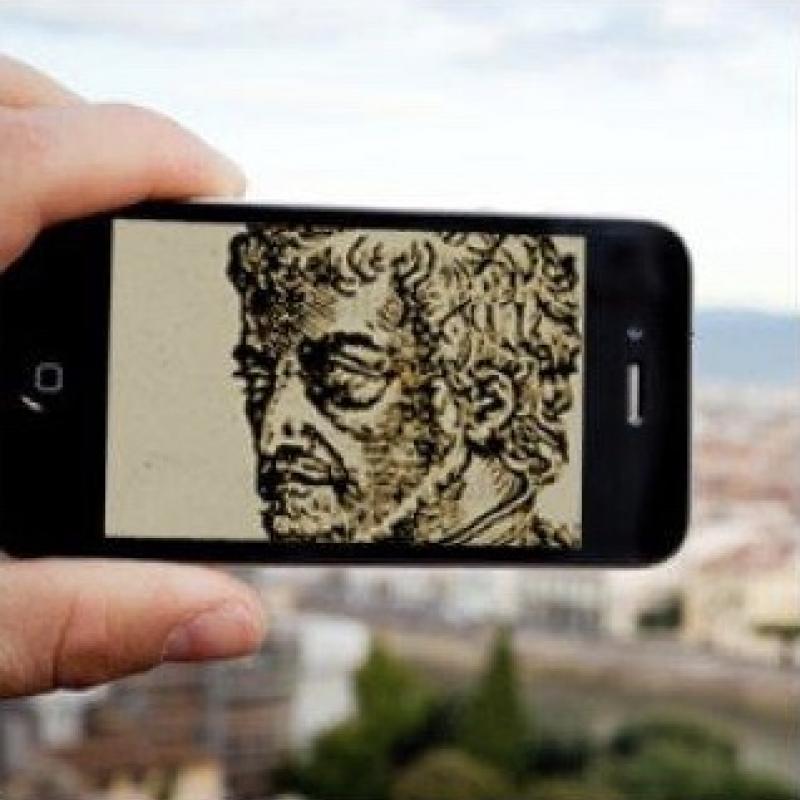 iPhone with image of an old sketched portrait