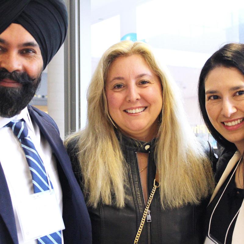 Three Academic Bridging Program graduates at the Bridging graduation event. 
