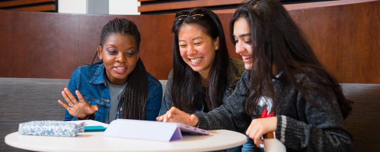 Three students working together in Kruger Hall