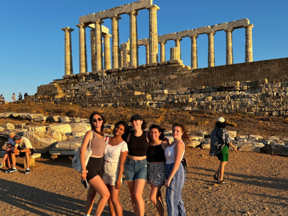 Summer Abroad students standing in front of some ruins in Greece.