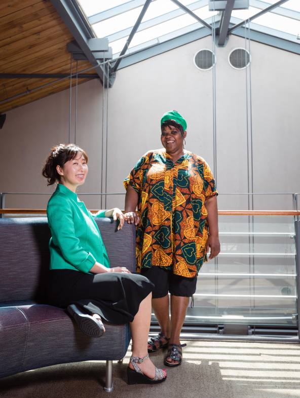 Two students beneath the skylight above Kruger Hall.