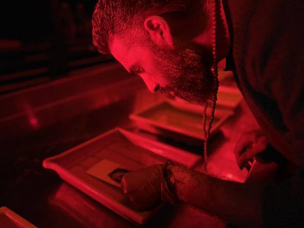 Woodsworth student and artist Masoud Riyazati in the darkroom