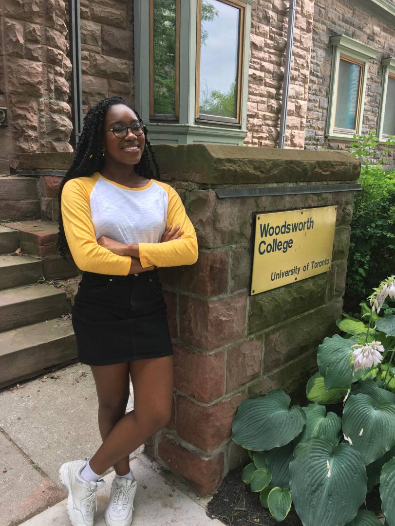 Former Woodsworth One student Abena Somiah poses on the front steps at Woodsworth College. 