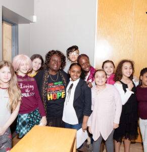 Image of Hon. Jean Augustine with girls from the Centre.