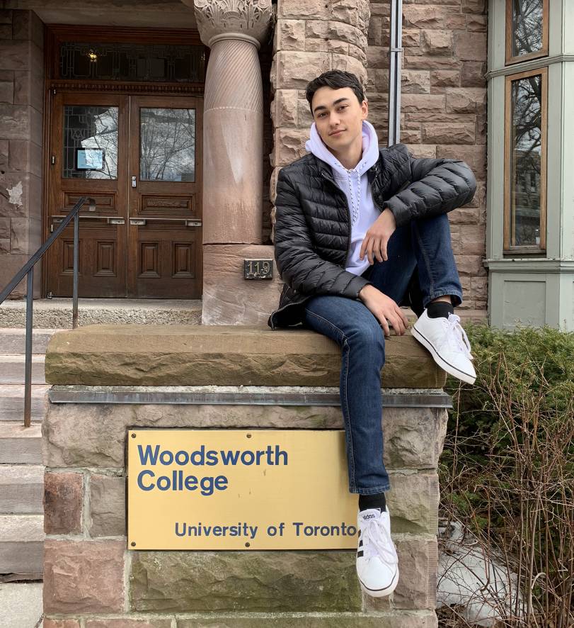 Former Woodsworth One student George Moshenski-Dubov poses on the front steps at Woodsworth College.