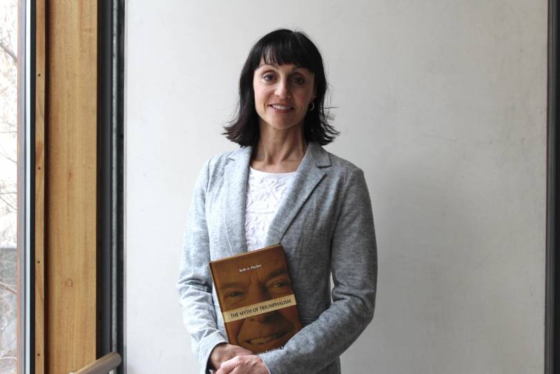 Professor Beth A. Fischer with her book.