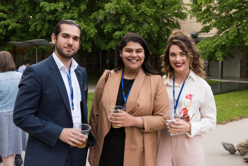 Image of three alumni in Alex Waugh courtyard