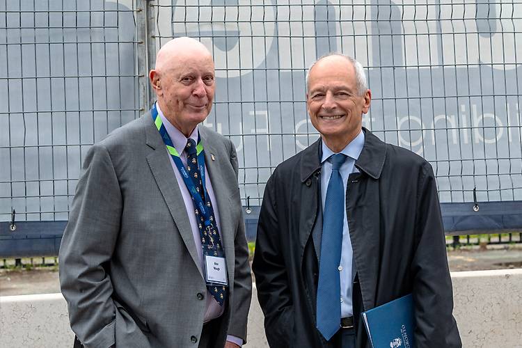 Longtime Woodsworth College community member Alex Waugh (left) with President Meric Gertler.